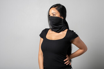 Studio shot of a woman of colour wearing a black gaiter