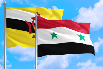 Syria and Brunei national flag waving in the windy deep blue sky. Diplomacy and international relations concept.