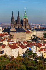Autumn Prague City with gothic Castle and colorful Nature and Trees from the Hill Petrin, Czech Republic