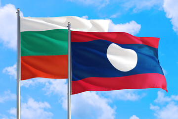 Laos and Bulgaria national flag waving in the windy deep blue sky. Diplomacy and international relations concept.
