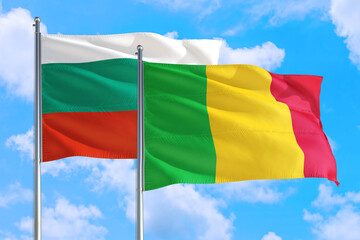 Mali and Bulgaria national flag waving in the windy deep blue sky. Diplomacy and international relations concept.