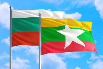 Myanmar and Bulgaria national flag waving in the windy deep blue sky. Diplomacy and international relations concept.