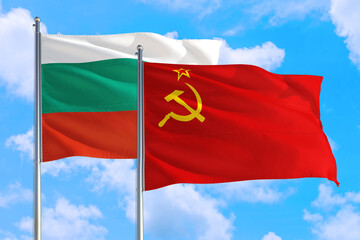 Soviet Union and Bulgaria national flag waving in the windy deep blue sky. Diplomacy and international relations concept.