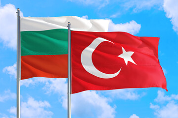 Turkey and Bulgaria national flag waving in the windy deep blue sky. Diplomacy and international relations concept.