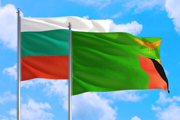 Zambia and Bulgaria national flag waving in the windy deep blue sky. Diplomacy and international relations concept.