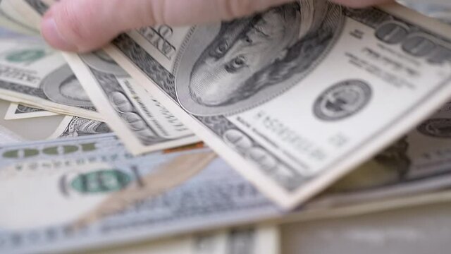 Hands Stir American Paper Money, Dollars. Cash on Table. Close-up. 4K