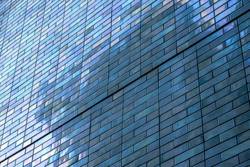 office building in the city. Abstract Detail Of Blue Vintage Tiled Wall, With Bright Sunlight, Backgrounds, Textures. Stock Photograph.