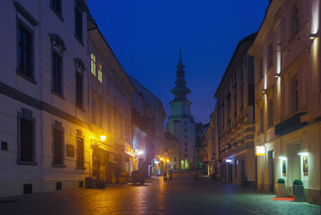 Fototapeta na wymiar Image of centre of Bratislava with Michael's Gate illuminated at dusk, Slovakia..