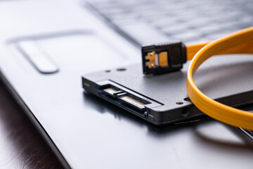 repairing and upgrading laptop computer. new solid state drive on a laptop. computer maintenance...
