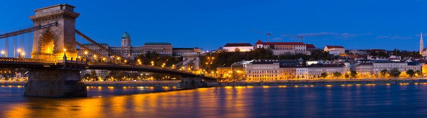 Fototapeta na wymiar Night light of Chain Bridge near Buda Fortress is hungarian landmark outdoors.