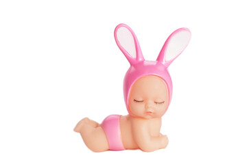 A cute doll in pink panties and a hat with bunny ears, with closed eyes. Lies on a white isolated background. Soft focus