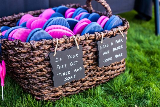 flip flop casual shoes in basket for guests to wear at wedding or event