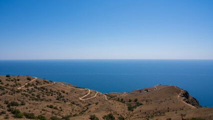 road leading to the coast and the lighthouse, sea view