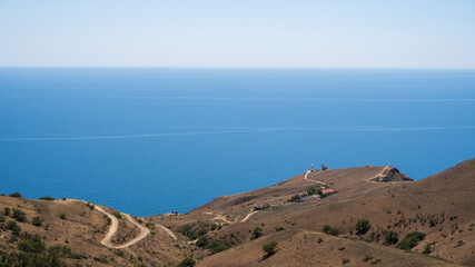 road leading to the coast and the lighthouse, sea view