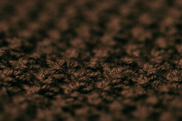 Atmospheric winter background, knitted scarf, warm sweater.