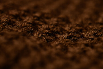 Atmospheric winter background, knitted scarf, warm sweater.