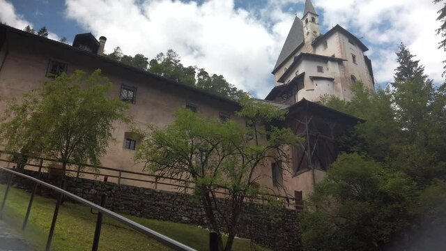 Sanctuary of San Romedio on a steep rocky spur in natural scenery. Panoramic bottom view of Romedio shrine on a hill.
St. Romedio Sanctuary in San Zeno, Val di Non, Trentino, Italy.

