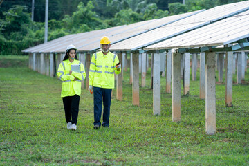 Solar power plant,Engineer working with tablet computer at Solar Panels Power Farm,Science solar energy,Photovoltaic Cell Park.
