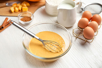 Preparing of tasty pumpkin muffins on table
