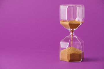 Hourglass on color background. Time management concept