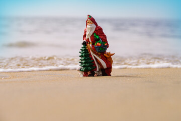 Christmas greeting cards design. Santa Claus on sea beach. Happy New Year and merry Christmas travel, tropical vacations concept.