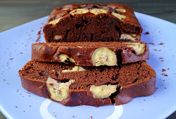 Slices of Flavorful Fresh Baked Homemade Dark Chocolate Banana Cake on a Plate