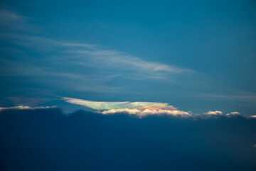 Beautiful iridescent cloud, Irisation or rainbow cloud on sky