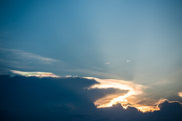 Beautiful iridescent cloud, Irisation or rainbow cloud on sky