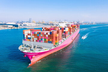 Fototapeta premium Aerial view cargo ship of business logistic transportation sea freight,Cargo ship, Cargo container in factory harbor at industrial estate for import export around in the world, Trade Port / Shipping 