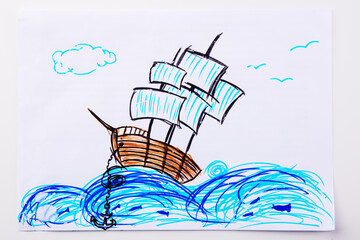 Children's paint ship in sea. Kid drawing a pirate ship and ocean waves.