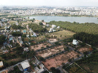 Fototapeta premium Aerial lake view of the buildings in the center of Bangalore city 