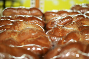 Photo of bun baked goods on the counter in a grocery store