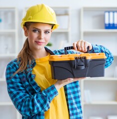 Woman with toolkit in workshop