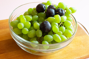 Summer fruits lie on a wooden surface.