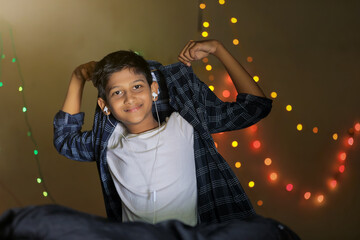 Cute indian little child showing expression over lighting background