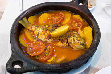 Tajine with stewed vegetables and fish. One of the types of Moroccan national cuisine.