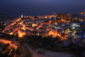 Aerial night view of Chefchaouen in Morocco. The city is noted for its buildings in shades of blue and that makes Chefchaouen very attractive to visitors.