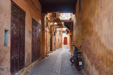 Fototapeta na wymiar Empty narrow streets of the Meknes medina. Meknes is one of the four Imperial cities of Morocco and the sixth largest city by population in the kingdom.