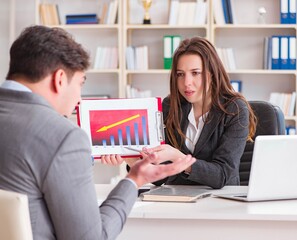 Business meeting between businessman and businesswoman