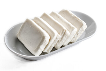 Nabulsi arabic cheese on white plate on a white background 