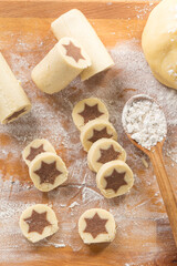 Baking christmas cookies with chocolate star.