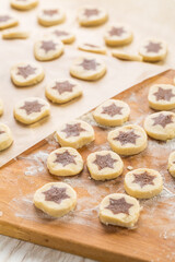 Baking christmas cookies with chocolate star.