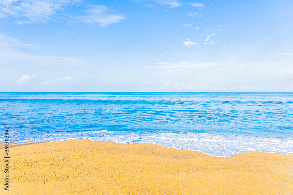 Wall mural Beautiful tropical beach sea ocean with blue sky and white cloud