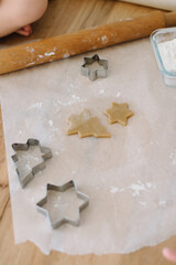 preparing christmas cookies, tree shape,flour, rolling pin