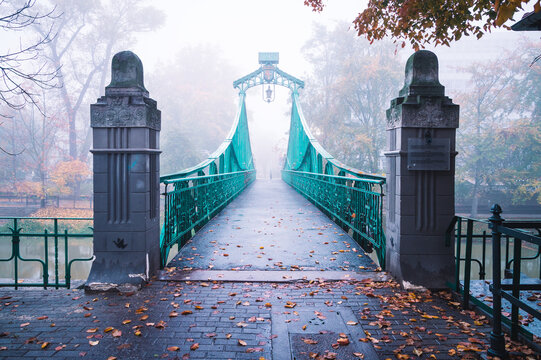 OPOLE, POLAND - Oct 29, 2020: the romantic Groszowy Bridge in Opole in the morning fog