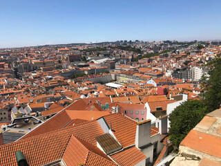 Fototapeta na wymiar Aerial view of red roofs of Alfama and the River Tagus in Lisbon Portugal