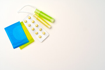 Flat lay of Pads, tampons and pills