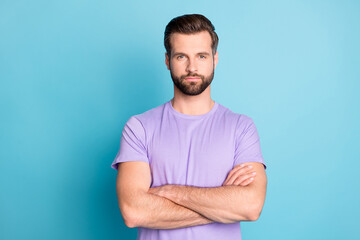 Obraz premium Photo of young attractive handsome man crossed hands confident smart isolated over blue color background