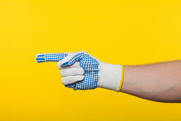 Worker work glove isolated on yellow background