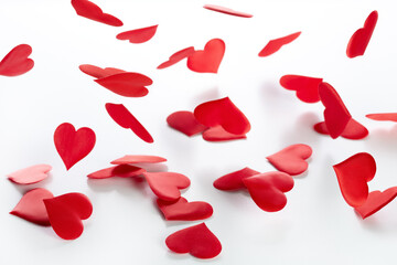 Valentine's day and wedding day, background of falling red satin hearts. Romantic greetings.